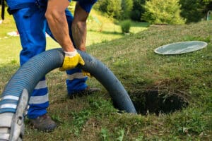 Worker maintaining a septic system