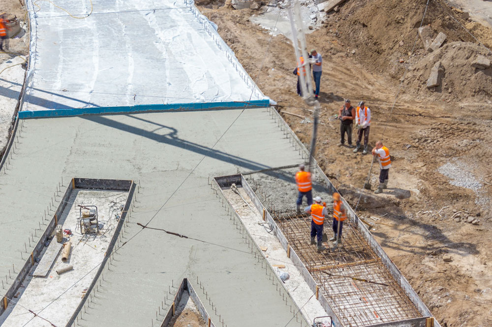 Workers preparing a site for concrete